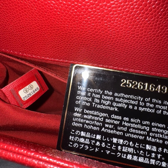 This is an authentic CHANEL Caviar Chevron Quilted Medium Boy Flap in Red - Picture 9 of 9